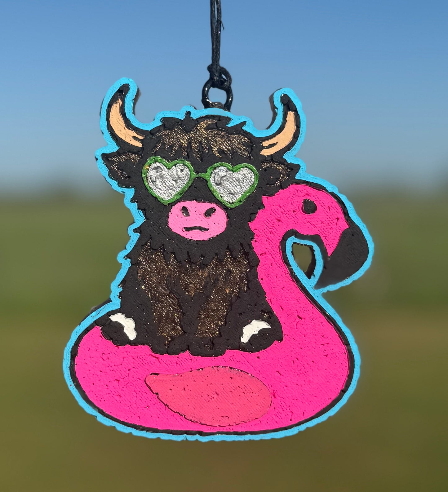 Highland in Flamingo with sunglasses in Floatie