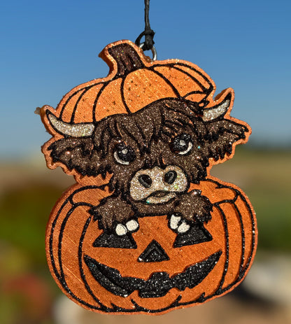 Highland Cow in Jack-O-Lantern