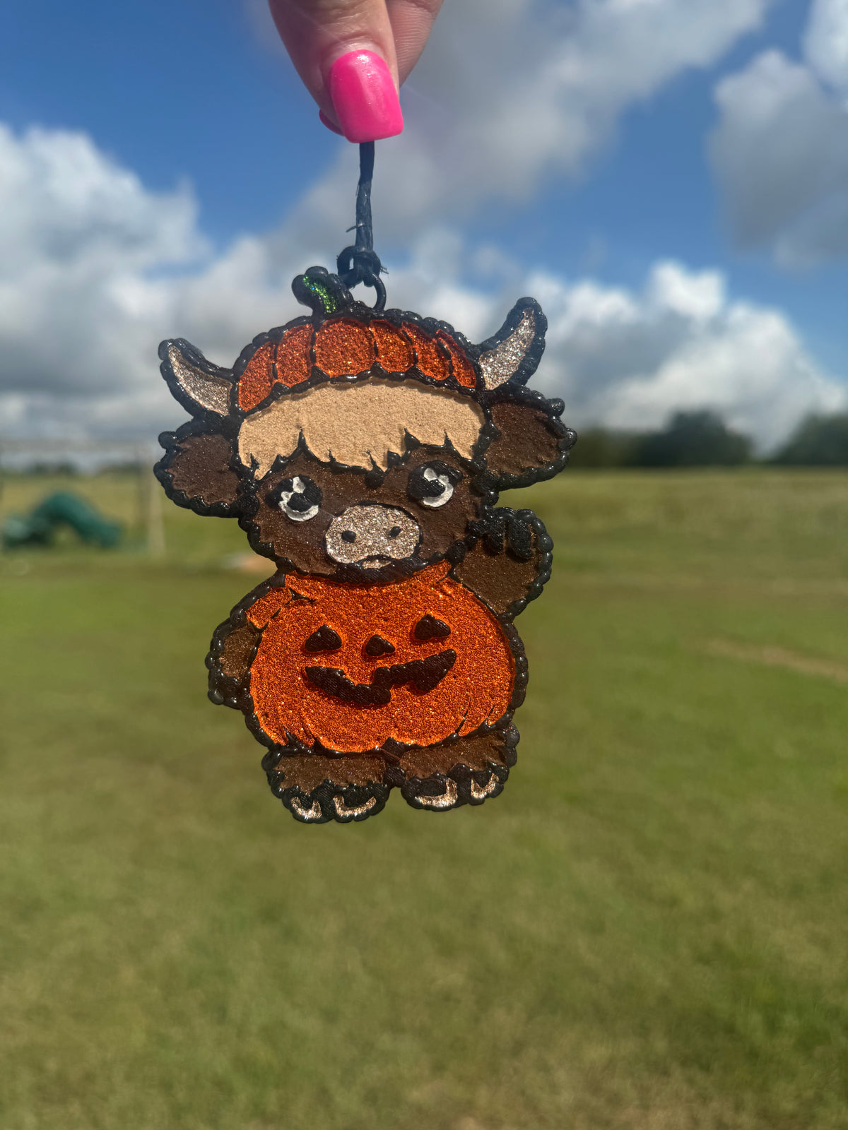 Highland Cow Dressed as a Pumpkin