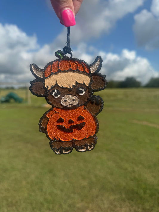 Highland Cow Dressed as a Pumpkin