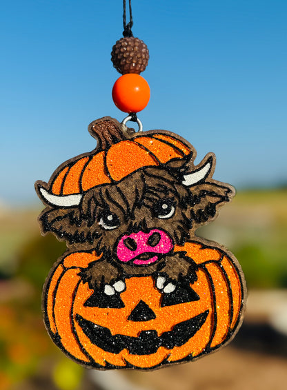 Highland Cow in Jack-O-Lantern