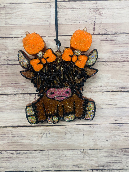 Highland Cow With Pumpkins