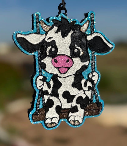 Holstein Cow on Swing