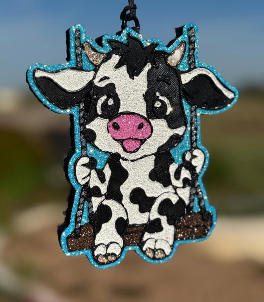 Holstein Cow on Swing